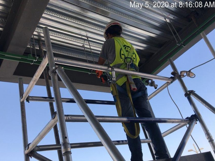 Technician working on scaffold