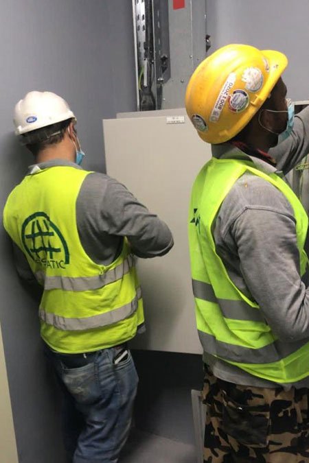 Technicians completing electrical panel works