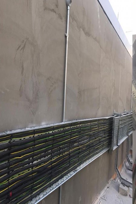 Cable routing along building facade